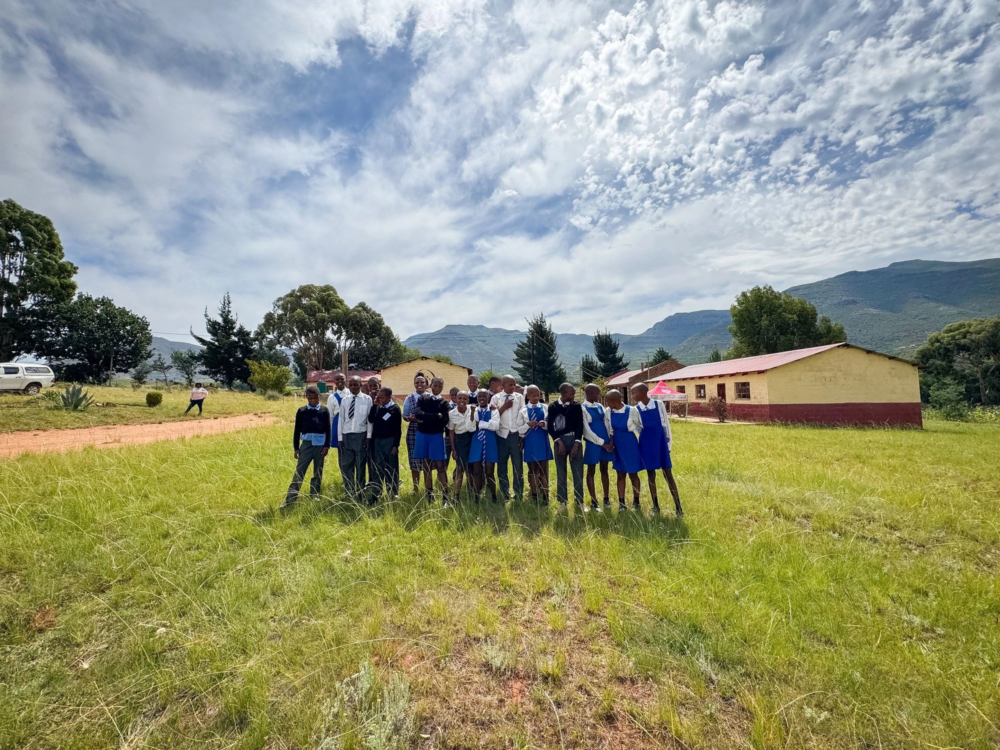 Students standing together on a school field