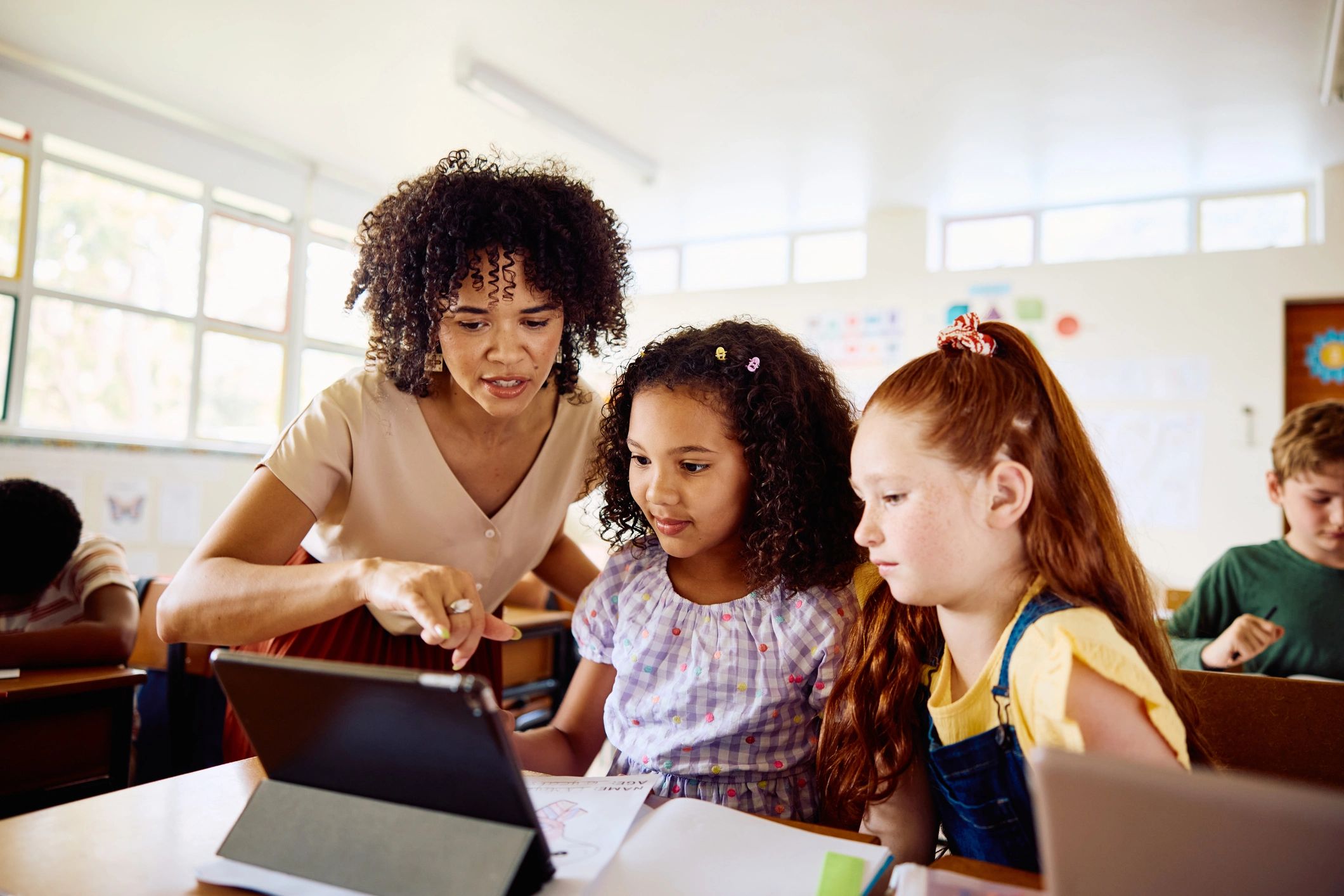 Teacher supporting students in class