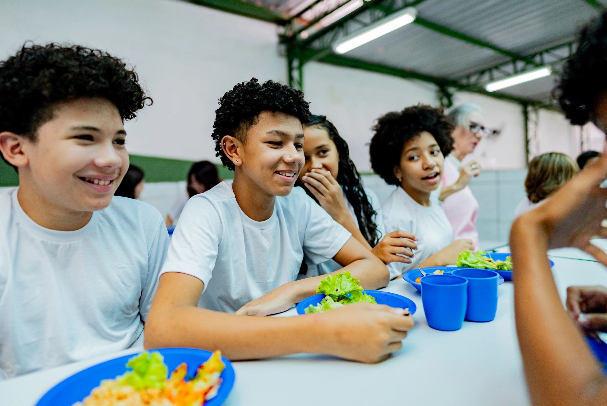 Students having lunch in a school cafeteria