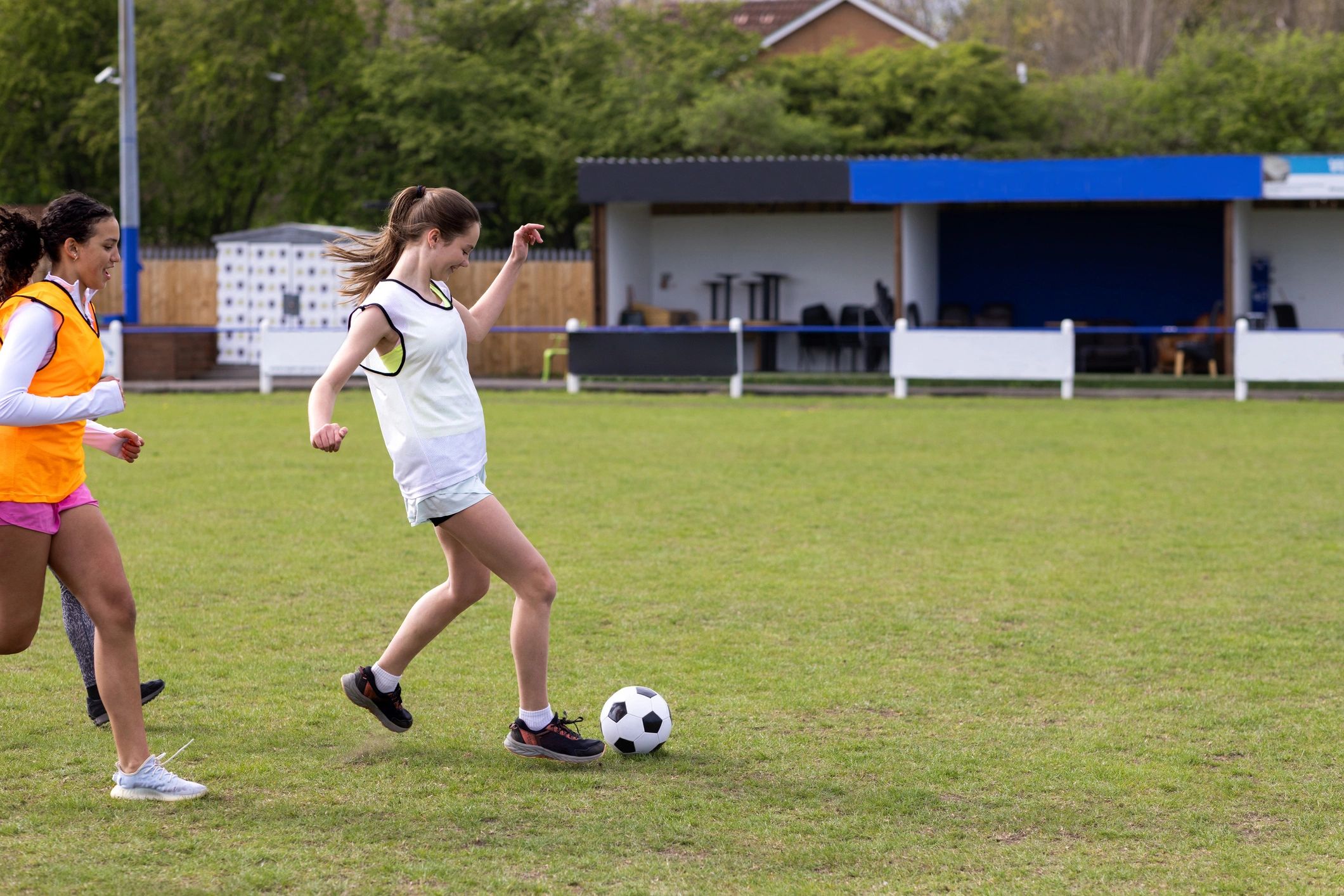 Students training on a football pitch