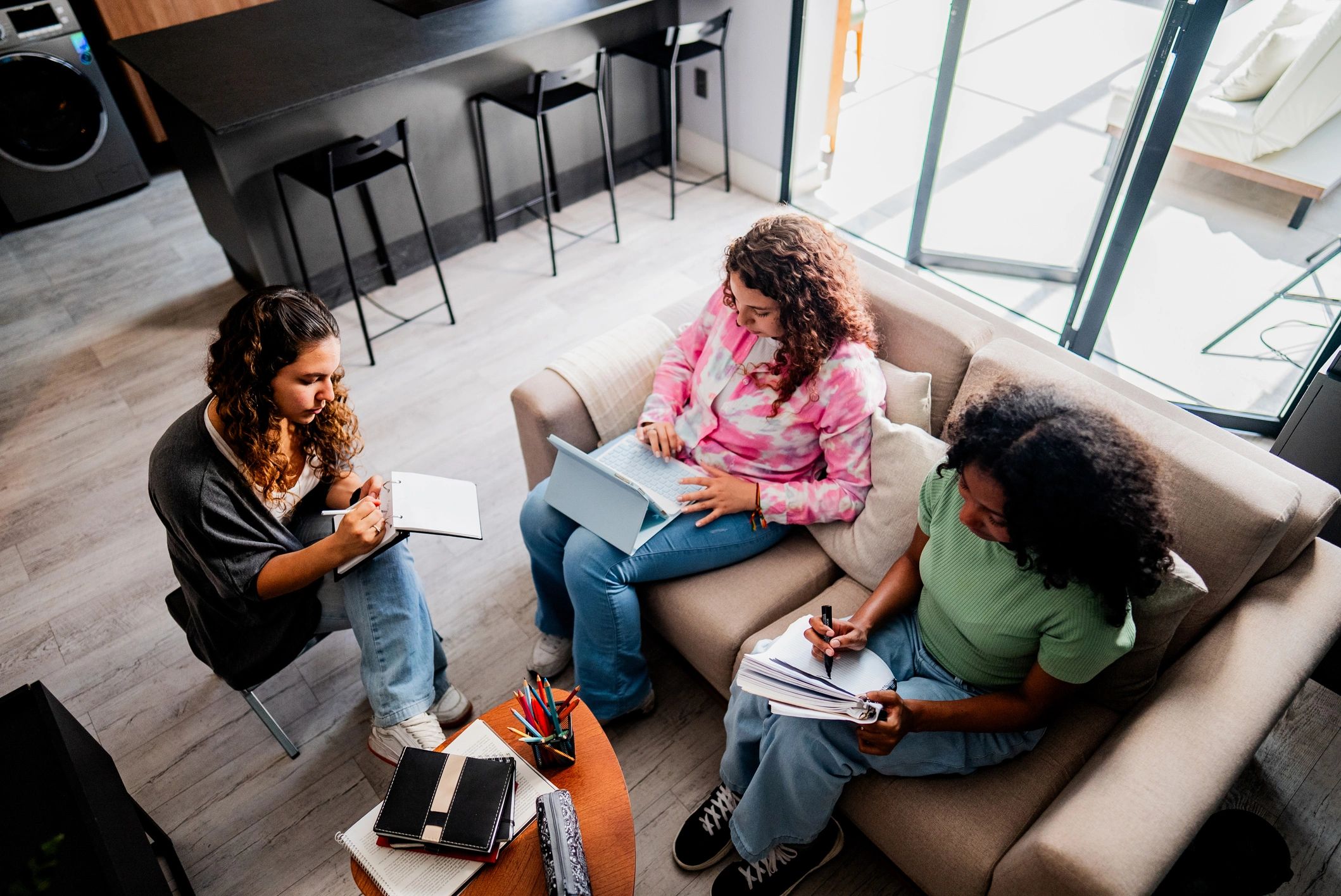 Friends studying together in a collaborative space